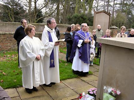 The dedication of the monument in the Garden of Remembrance by the Venerable Paul Hughes, Archdeacon of Bedford