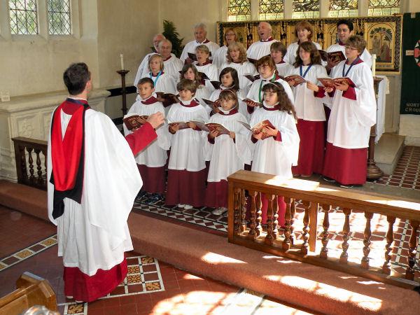 Members of the St Marys Eaton Bray choir with choirmaster Stephen Axford.